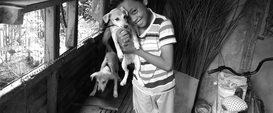 Boy with puppy at Sitio Kasagingan, Tanjay City.