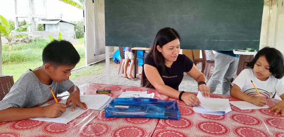 volunteer teacher in action