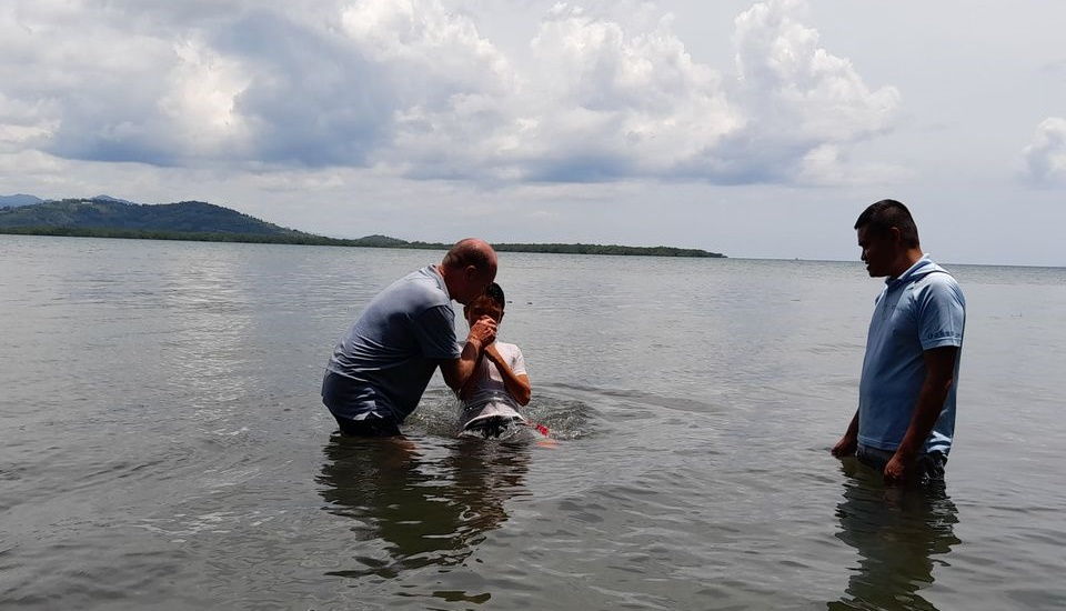 Angelo being baptized