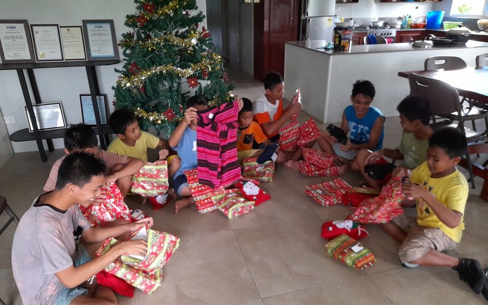 CEA boys opening their gifts - December 2021