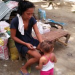 Mother with child at Sitio Kasagingan Tanjay City