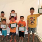 The CEA kids proudly displaying their work