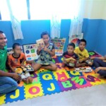 House parents spending time with the kids at the Children's Library.